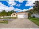 Lovely single-story residence with a two-car garage, tidy landscaping, and a welcoming entrance at 2507 Monaco Cove Cir, Orlando, FL 32825
