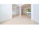 Spacious living area boasts neutral tile floors, white walls, and recessed lighting fixtures at 2507 Monaco Cove Cir, Orlando, FL 32825