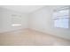 A spacious living room features tiled floors, white walls, base trim and natural light at 2507 Monaco Cove Cir, Orlando, FL 32825