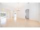 Expansive living room with tile flooring, white walls, and easy access to other rooms at 2507 Monaco Cove Cir, Orlando, FL 32825