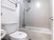 Modern bathroom featuring a tub and shower combination with gray tiled walls and sleek fixtures at 5245 W Irlo Bronson Memorial Hwy # 244, Kissimmee, FL 34746