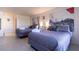 Bright bedroom with two beds, decorative artwork, and stylish gray bedding at 5245 W Irlo Bronson Memorial Hwy # 244, Kissimmee, FL 34746