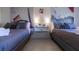 Bright bedroom featuring two beds with stylish decor at 5245 W Irlo Bronson Memorial Hwy # 244, Kissimmee, FL 34746
