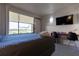 Cozy bedroom with a bed, desk, and large window at 5245 W Irlo Bronson Memorial Hwy # 244, Kissimmee, FL 34746