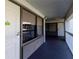Exterior hallway with doors, windows, railings, and exit sign at 5245 W Irlo Bronson Memorial Hwy # 244, Kissimmee, FL 34746