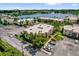 Aerial view of buildings surrounded by lake and landscaping at 544 Orange Dr # 10, Altamonte Springs, FL 32701