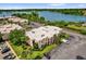 Aerial view of building surrounded by lake and landscaping at 544 Orange Dr # 10, Altamonte Springs, FL 32701