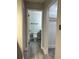 This bathroom includes a toilet and vanity, connected by a door that provides easy access to a storage closet at 544 Orange Dr # 10, Altamonte Springs, FL 32701