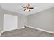 Bedroom featuring wood-look flooring, a ceiling fan, and ample closet space at 544 Orange Dr # 10, Altamonte Springs, FL 32701