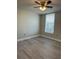 Bright bedroom with light gray flooring, ceiling fan, window with blinds and neutral colored walls at 544 Orange Dr # 10, Altamonte Springs, FL 32701