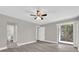 Spacious bedroom featuring light walls, wood-look flooring, and access to the Primary bath and patio at 544 Orange Dr # 10, Altamonte Springs, FL 32701