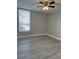 Bright bedroom with light gray flooring, ceiling fan, window with blinds and neutral colored walls at 544 Orange Dr # 10, Altamonte Springs, FL 32701