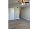 Bright bedroom with light gray flooring, closet, ceiling fan and neutral colored walls at 544 Orange Dr # 10, Altamonte Springs, FL 32701