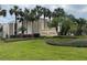 Exterior view of the Royal Arms Condominium building with lush landscaping at 544 Orange Dr # 10, Altamonte Springs, FL 32701