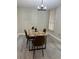 Dining room area featuring contemporary table, chairs and a stylish light fixture at 544 Orange Dr # 10, Altamonte Springs, FL 32701