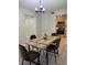 Dining room with modern light fixture, wood table, and contemporary chairs at 544 Orange Dr # 10, Altamonte Springs, FL 32701