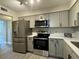 Updated kitchen featuring stainless steel appliances and modern cabinets at 544 Orange Dr # 10, Altamonte Springs, FL 32701