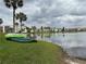 Beautiful lake view of the property with boats on shore, and well-maintained landscaping at 544 Orange Dr # 10, Altamonte Springs, FL 32701