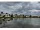 Scenic lake view featuring manicured grounds and white buildings reflecting in the water at 544 Orange Dr # 10, Altamonte Springs, FL 32701