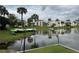 Tranquil lake view with boats and lush landscaping framing the residence at 544 Orange Dr # 10, Altamonte Springs, FL 32701