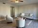 Inviting living room with plush seating, a ceiling fan, and neutral decor at 544 Orange Dr # 10, Altamonte Springs, FL 32701
