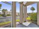 Screened patio shows the exterior of the community with parking and well-maintained landscaping at 544 Orange Dr # 10, Altamonte Springs, FL 32701