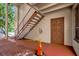 Exterior staircase leading to upper unit entrance with red caution tape for tripping hazard at 544 Orange Dr # 10, Altamonte Springs, FL 32701
