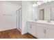 Modern bathroom featuring double vanity sinks, spacious walk-in shower, and sleek fixtures at 2107 Riley Ave, Eagle Lake, FL 33839