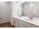 Modern bathroom featuring double vanity, sleek fixtures, and a spacious shower with white tile at 2107 Riley Ave, Eagle Lake, FL 33839