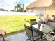 Inviting backyard patio with outdoor seating overlooking a spacious lawn at 2109 Woodsedge Dr, Kissimmee, FL 34746