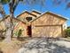 Charming single Gathering home with a well-manicured lawn and a two-car garage at 2109 Woodsedge Dr, Kissimmee, FL 34746