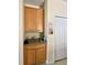 Cozy kitchen nook featuring wooden cabinets and ample counter space for storage and meal preparation at 2109 Woodsedge Dr, Kissimmee, FL 34746
