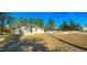 House with driveway and yard, located on a tree-lined street at 6809 149Th Lane Rd, Ocala, FL 34473