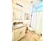 Clean bathroom with granite vanity and marble tile at 6809 149Th Lane Rd, Ocala, FL 34473