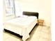 Bedroom with a queen-size bed and wood nightstand at 6809 149Th Lane Rd, Ocala, FL 34473