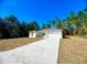 Newly constructed home with a two-car garage and long driveway at 6809 149Th Lane Rd, Ocala, FL 34473