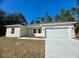 New construction home with attached garage and driveway at 6809 149Th Lane Rd, Ocala, FL 34473