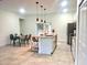 Modern kitchen with white cabinets, granite countertops and breakfast bar at 6809 149Th Lane Rd, Ocala, FL 34473