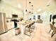 Modern kitchen with white cabinets, stainless steel appliances, and an island at 6809 149Th Lane Rd, Ocala, FL 34473
