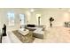 Bright and airy living room featuring a sectional sofa and large TV at 6809 149Th Lane Rd, Ocala, FL 34473