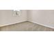 Cozy carpeted bedroom with a window providing natural light at 814 Ballantyne Dr, Lake Wales, FL 33898
