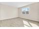 Sunlit bedroom with neutral carpet and view of backyard at 814 Ballantyne Dr, Lake Wales, FL 33898