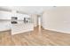 Open-concept living area featuring wood-look tile flooring and bright natural light at 814 Ballantyne Dr, Lake Wales, FL 33898