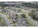Aerial shot of a residential area with well-maintained homes, a community pool, and lush landscaping at 1493 Magellan Cir # 504, Orlando, FL 32818