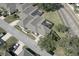 Aerial view of a neighborhood featuring homes with screened-in patios, manicured lawns, and well-maintained streets at 1493 Magellan Cir # 504, Orlando, FL 32818