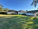 A spacious, grassy backyard has a privacy fence and an enclosed patio at 1493 Magellan Cir # 504, Orlando, FL 32818