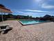 Brightly lit community pool on a sunny day complete with picnic seating and shade at 1493 Magellan Cir # 504, Orlando, FL 32818