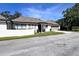 Inviting home featuring a well-kept lawn, attached garage, and a clean, modern exterior at 1493 Magellan Cir # 504, Orlando, FL 32818
