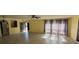 Spacious living room with neutral tile flooring and plenty of natural light at 1493 Magellan Cir # 504, Orlando, FL 32818