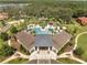 Resort-style pool area featuring palm trees, splash pad, and comfortable lounge chairs, perfect for relaxation at 2505 Dharma Cir, Kissimmee, FL 34746